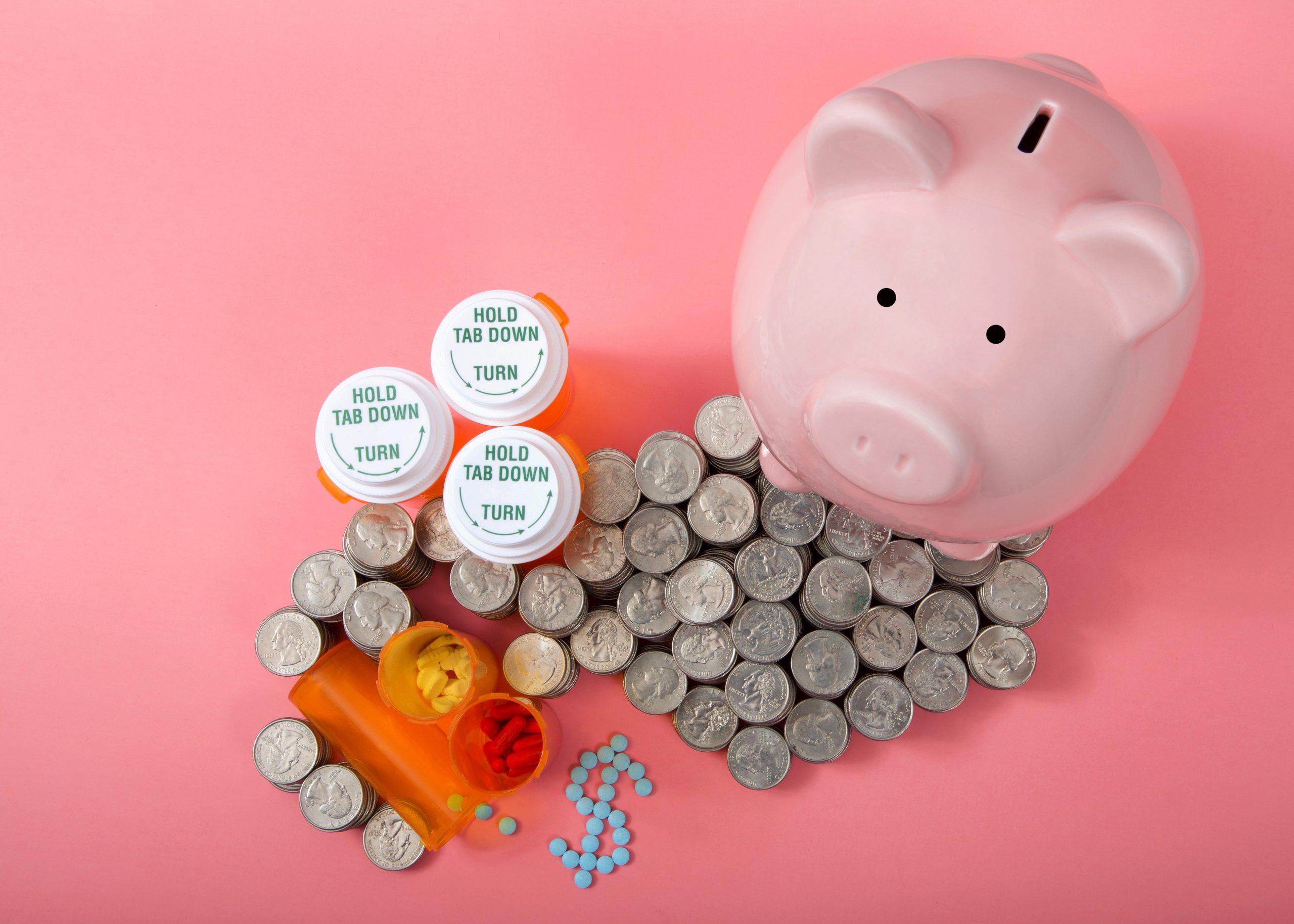 Flat Lay Of Pink Piggy Bank Next To Stacks Of Coin Cash Piled Hi