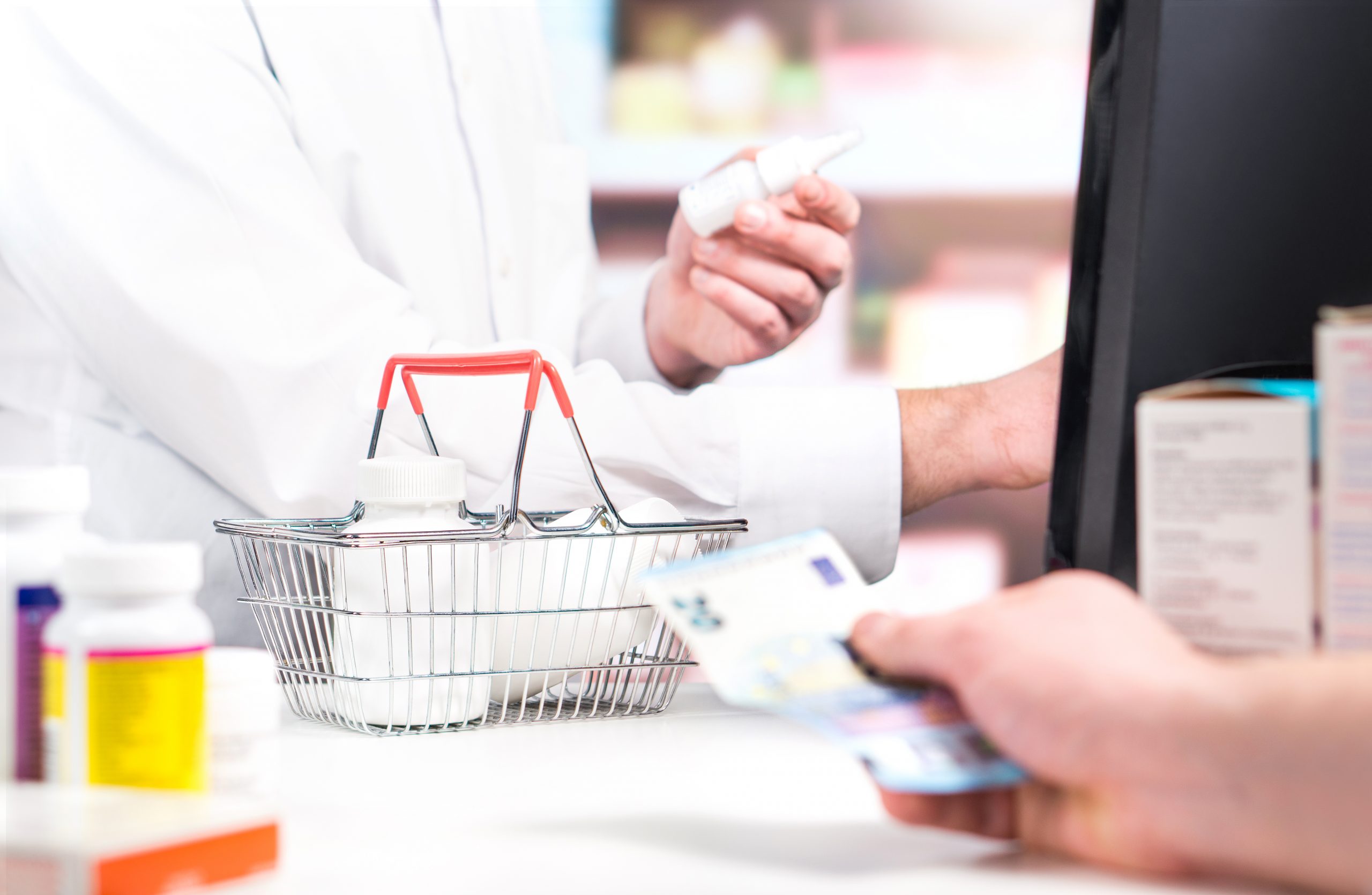 Pharmacist And Customer At Pharmacy Counter. Patient Buying Medi